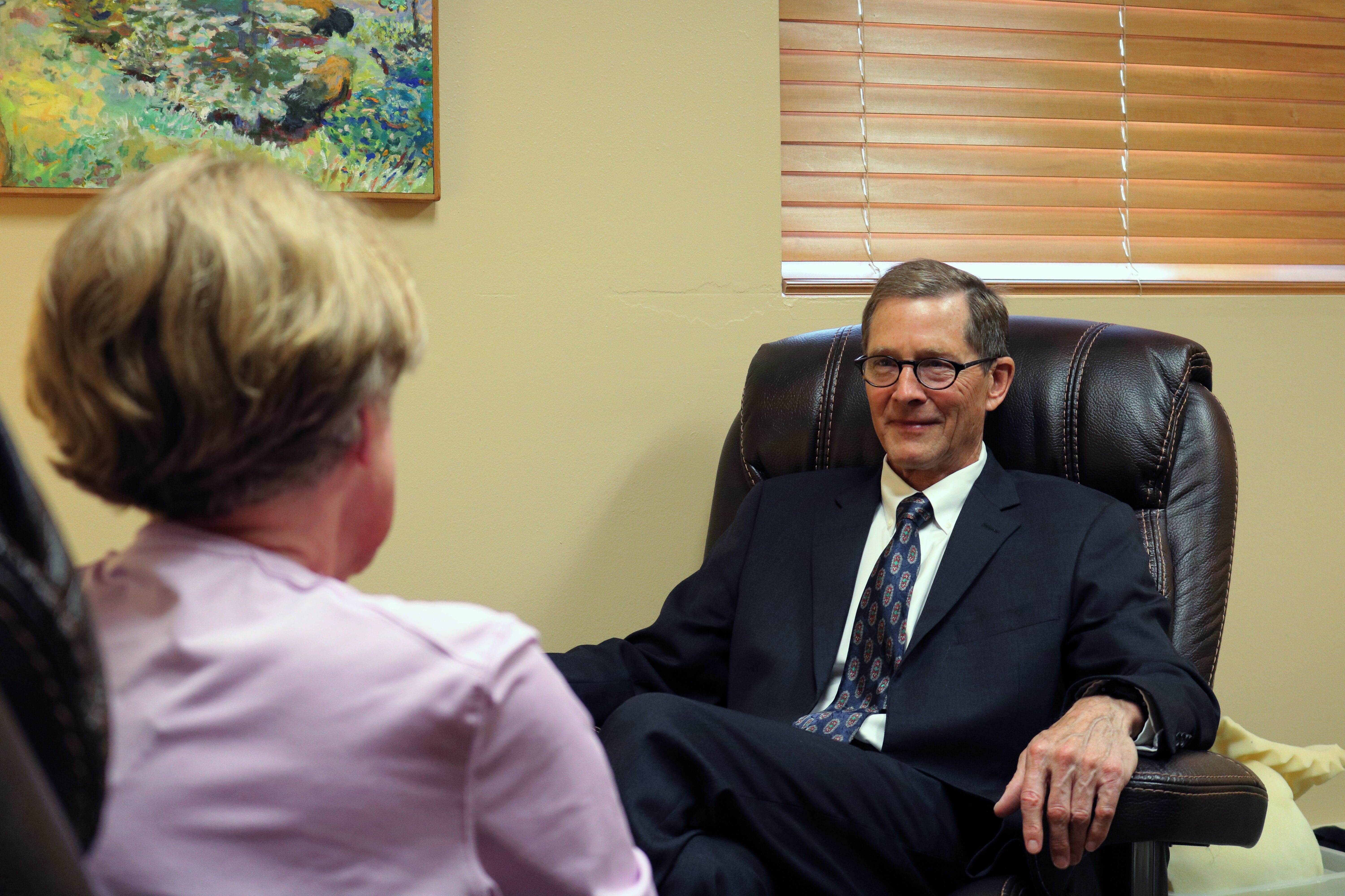 forensic psychiatrist stephen manlove sits across from patient during psychiatric evaluation